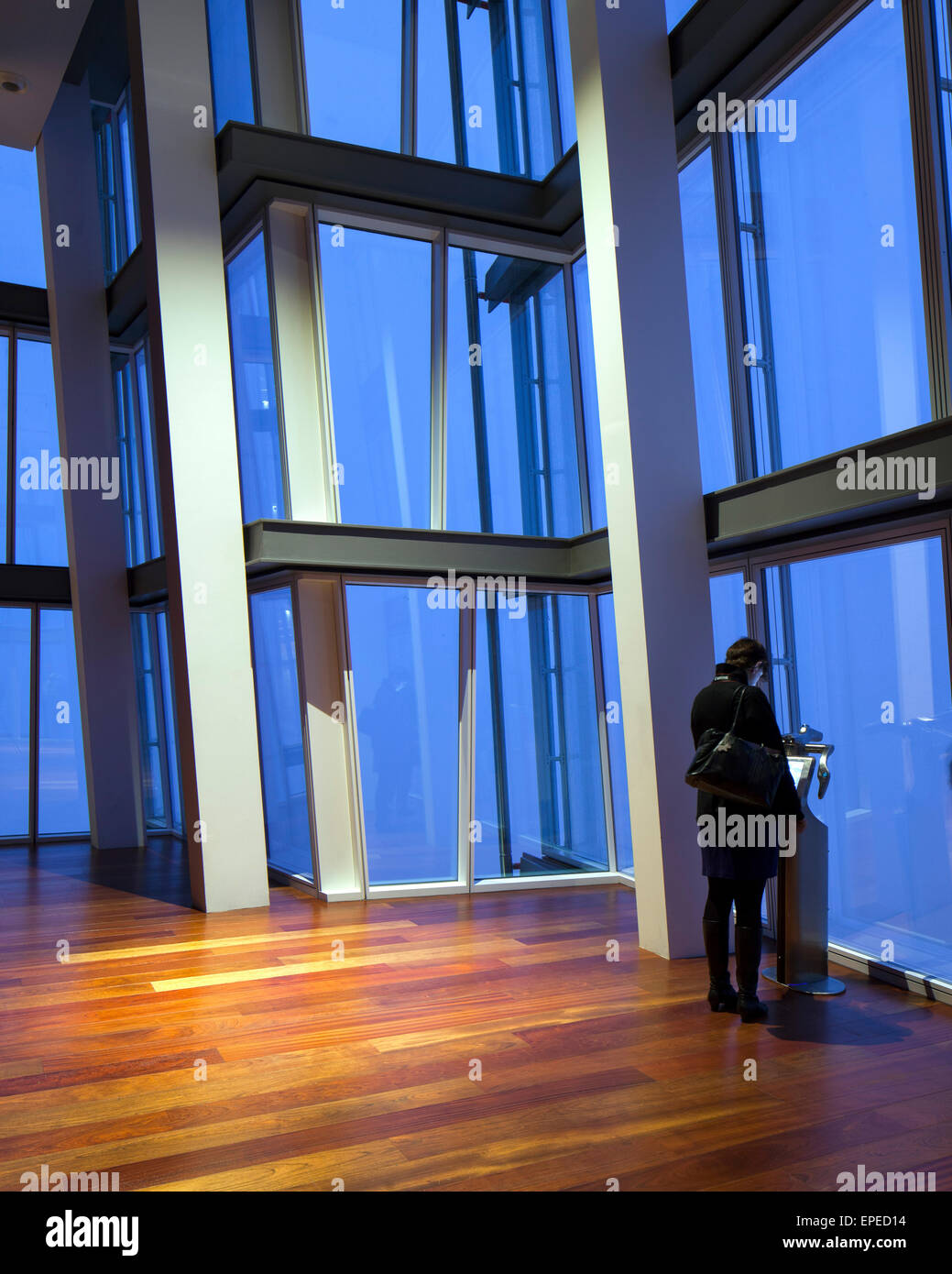 Person looking at the information screen. The Shard, London, United Kingdom. Architect: Renzo Piano Building Workshop, 2012. Stock Photo