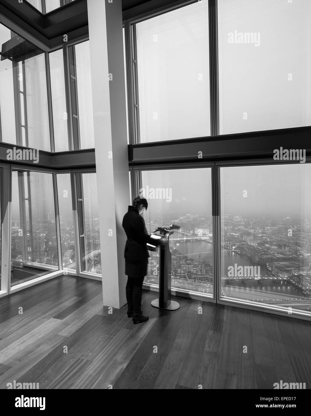 Person looking at the information screen. The Shard, London, United Kingdom. Architect: Renzo Piano Building Workshop, 2012. Stock Photo