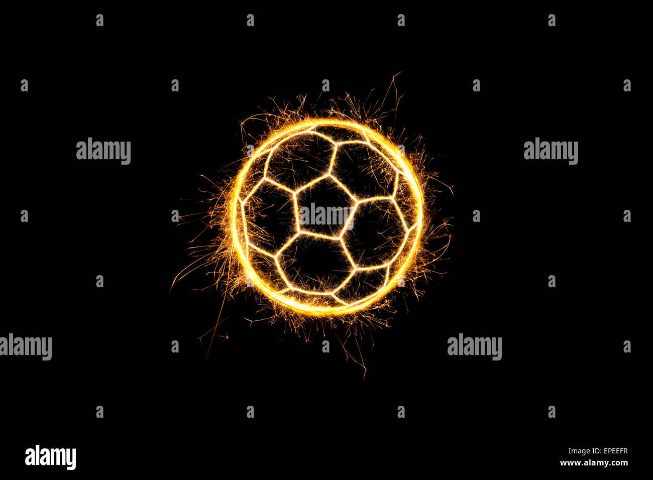 Soccer ball made of sparkling lights isolated on black background. Soccer background. Stock Photo