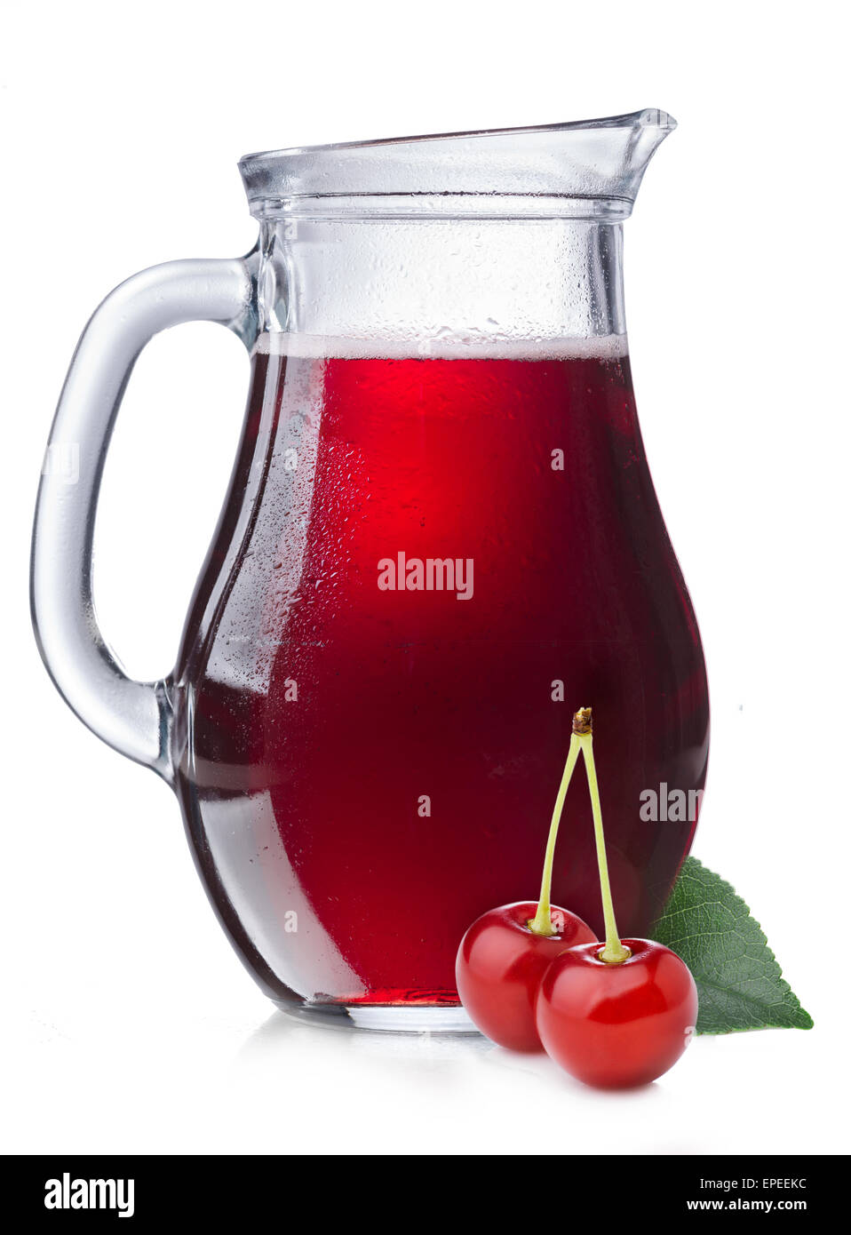 Cherry juice in a misted pitcher. Full jug of sour cherry juice with