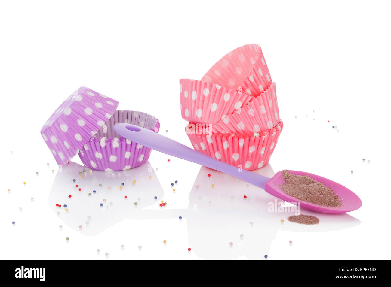 Baking powder and colorful dotted paper vintage baking forms isolated