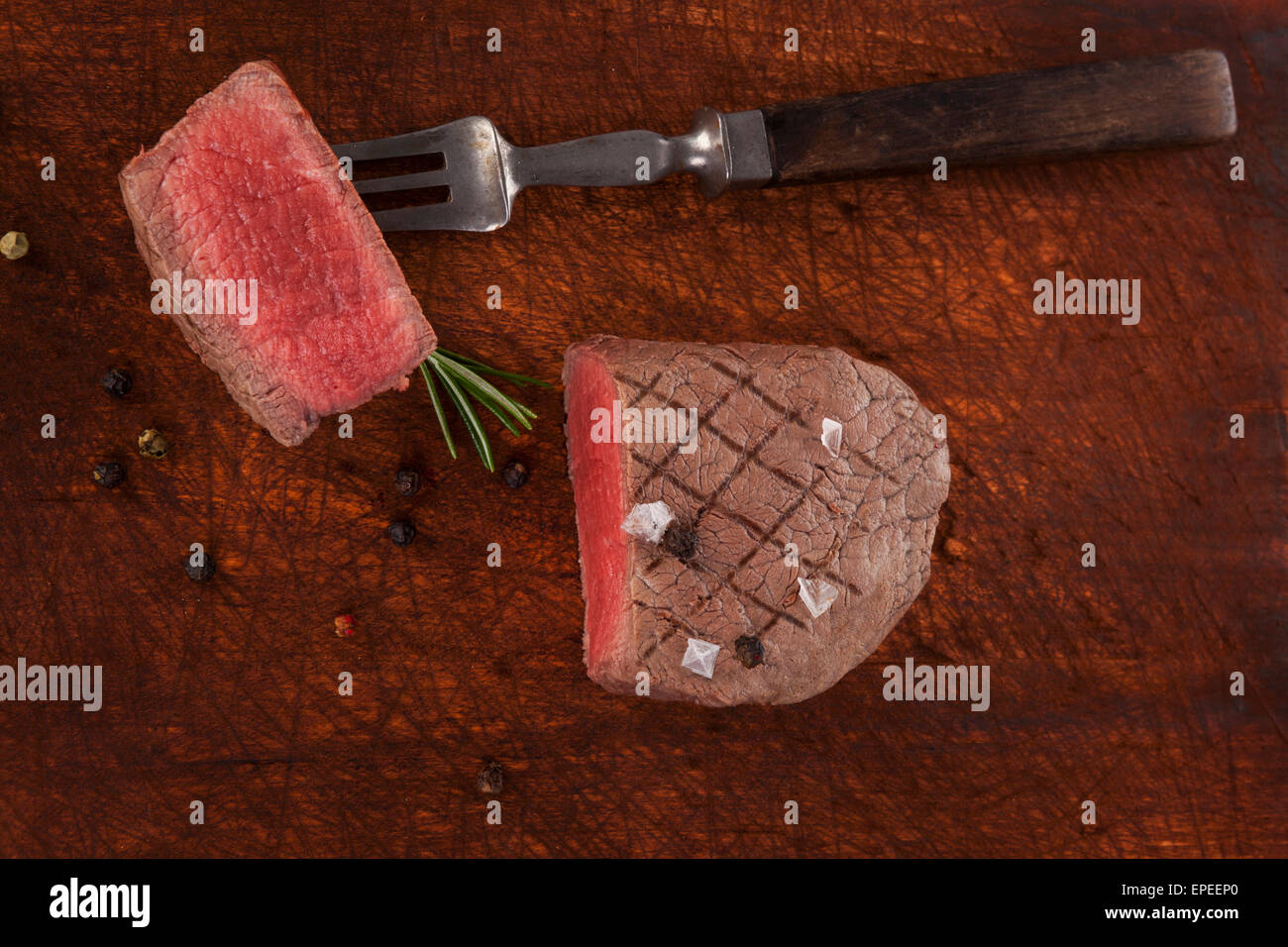 Luxurious big beefsteak on wooden background, top view. Culinary steak