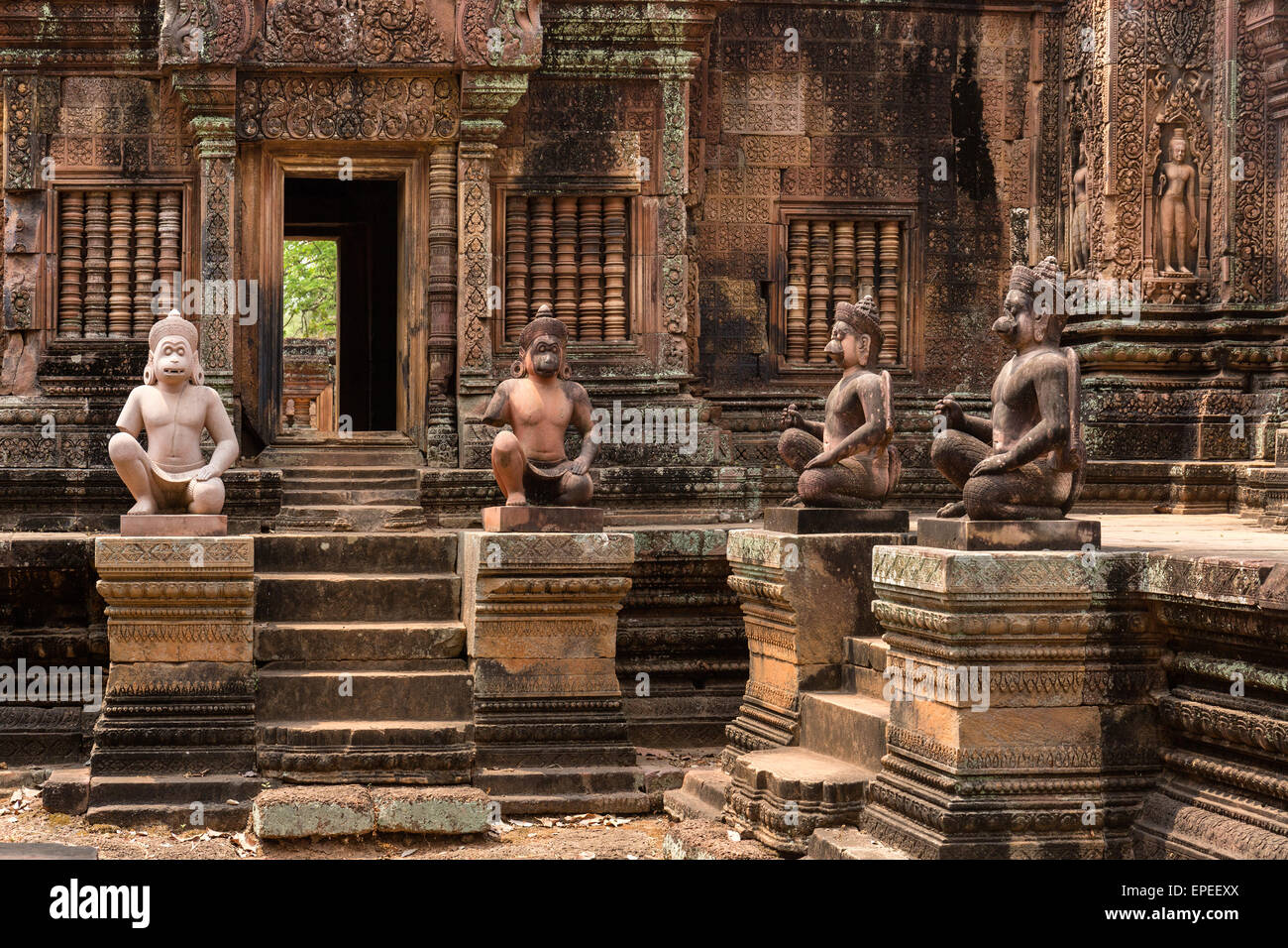 Yaksha Guardian, ape-like guardian figures in front of the Mandapa, Khmer Hindu temple Banteay Srei, Angkor region Stock Photo