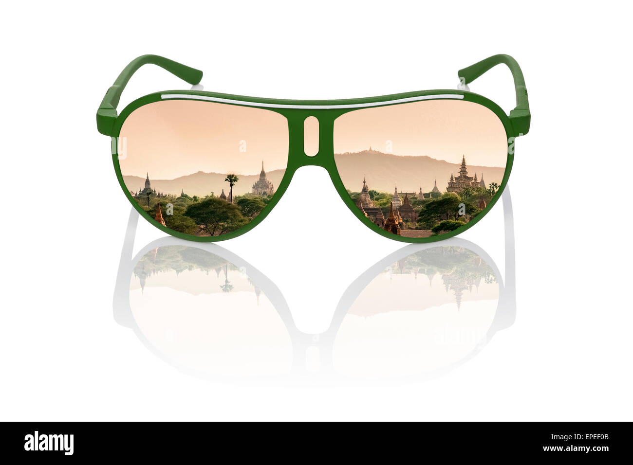 Travel dreams. Antique bagan temples at sunset reflection in sunglasses isolated on white background. Asian travelling. Stock Photo
