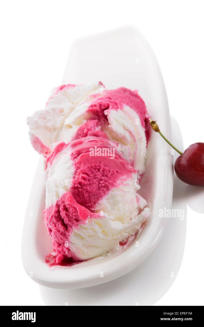 Cherry ice cream in bowl isolated on white background. Fruit ice cream eating. Stock Photo