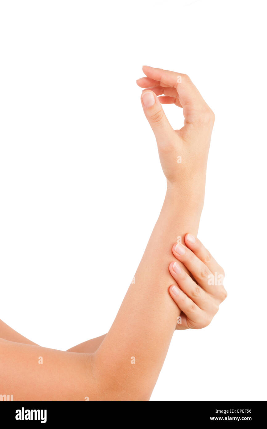 Female hand holding her forearm isolated on white background. Forearm