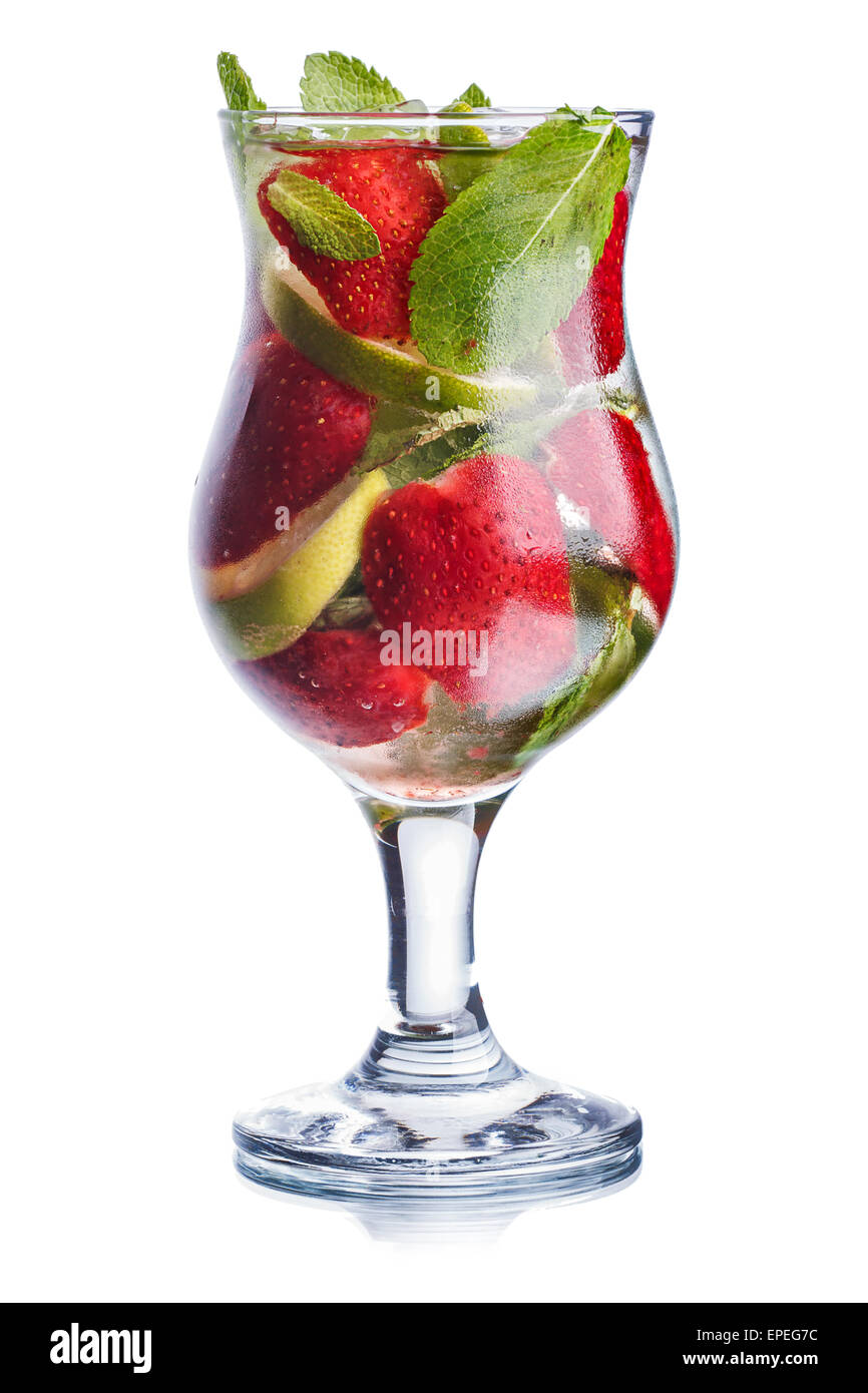 Strawberry mojito in hurricane glass. Cold refreshing cocktail with lime and mint. Traditional mojito with modern twist. Stock Photo