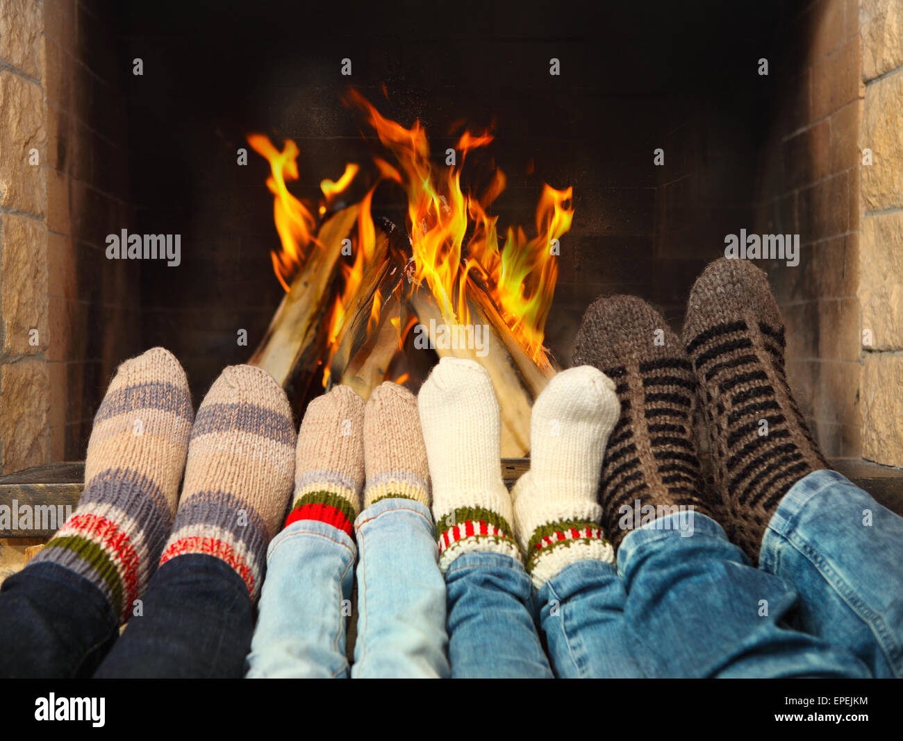 Feet warming near the fireplace Stock Photo Alamy
