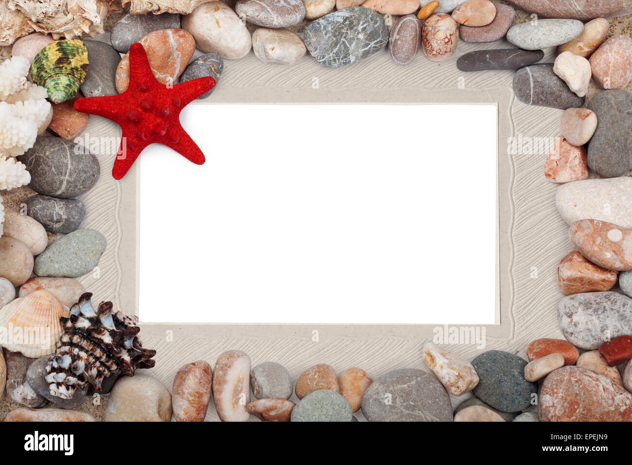 Paper Vintage photo frame with red starfish and pebbles Stock Photo