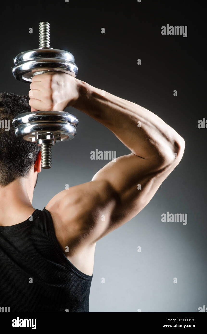 Muscular ripped bodybuilder with dumbbells Stock Photo - Alamy