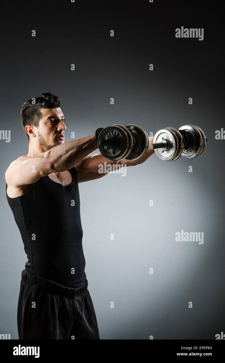 Muscular ripped bodybuilder with dumbbells Stock Photo - Alamy