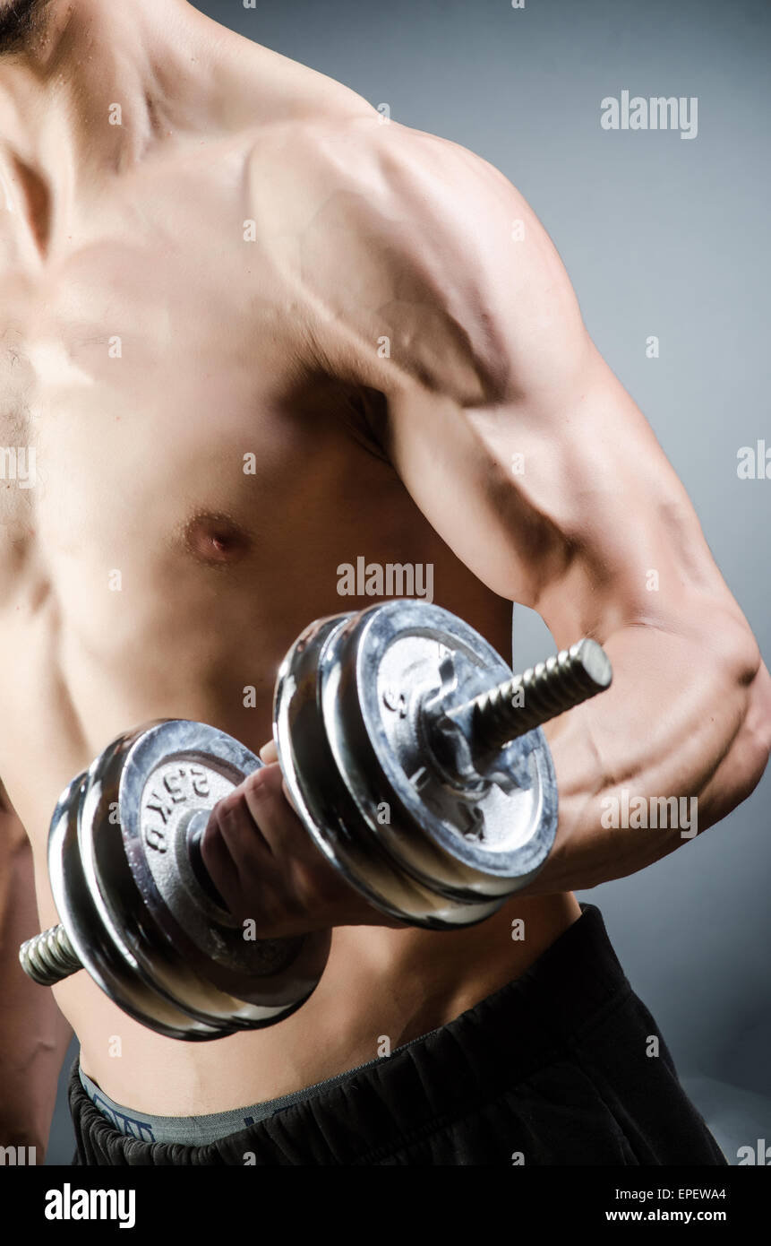 Muscular ripped bodybuilder with dumbbells Stock Photo - Alamy