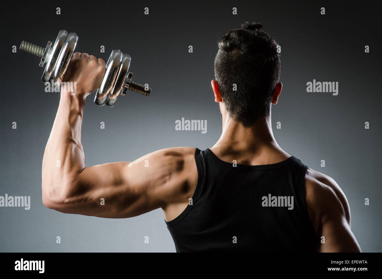 Muscular ripped bodybuilder with dumbbells Stock Photo - Alamy