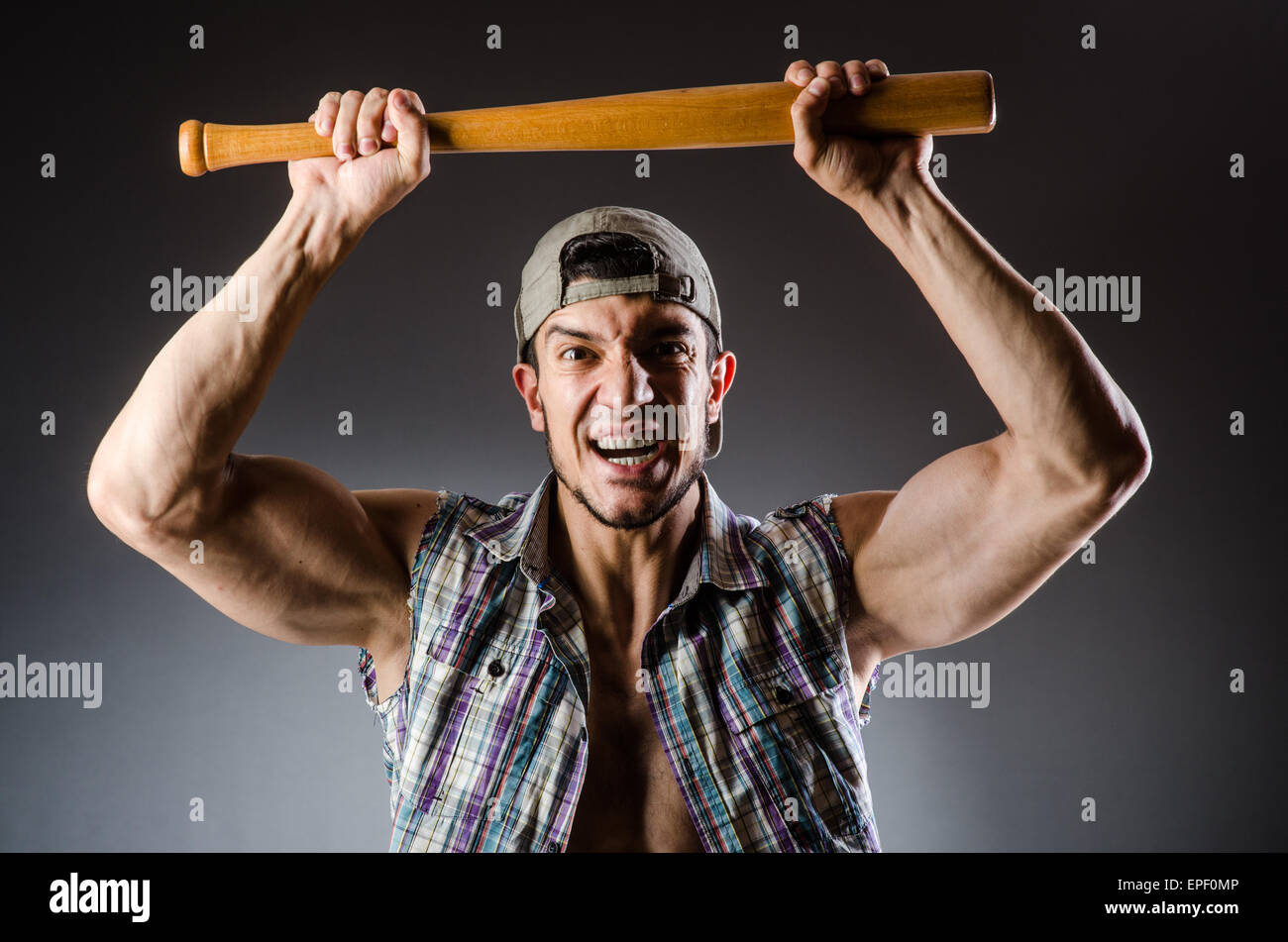 Violent man with baseball bat and hat Stock Photo Alamy