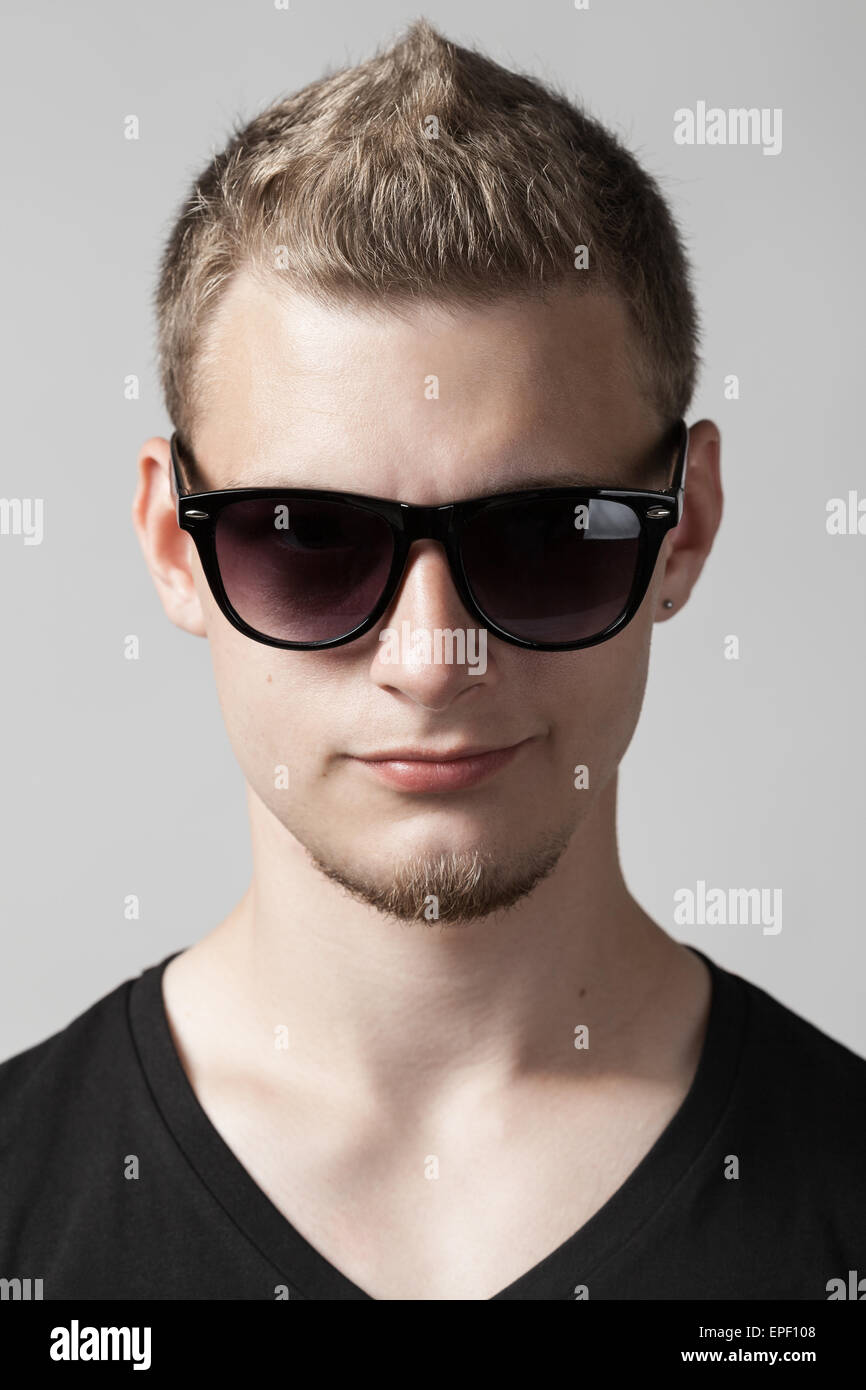 portrait of young man in sunglasses isolated Stock Photo - Alamy