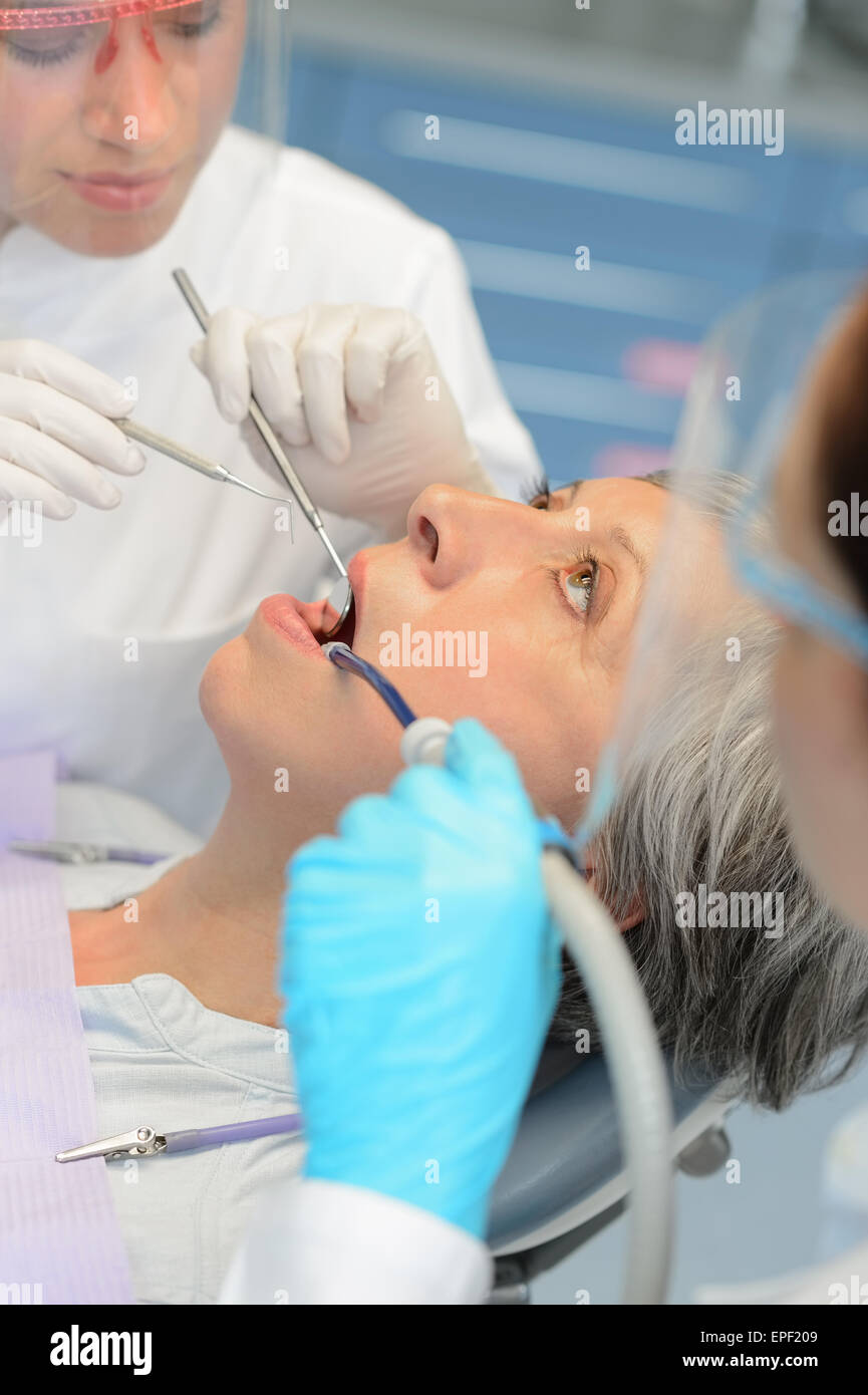 Professional dentists checkup senior patient woman Stock Photo