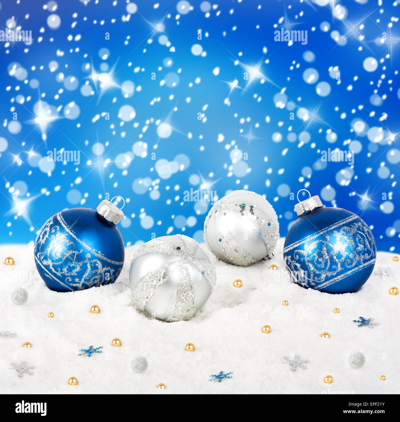Blue and silver Christmas balls on snow background with stars Stock ...