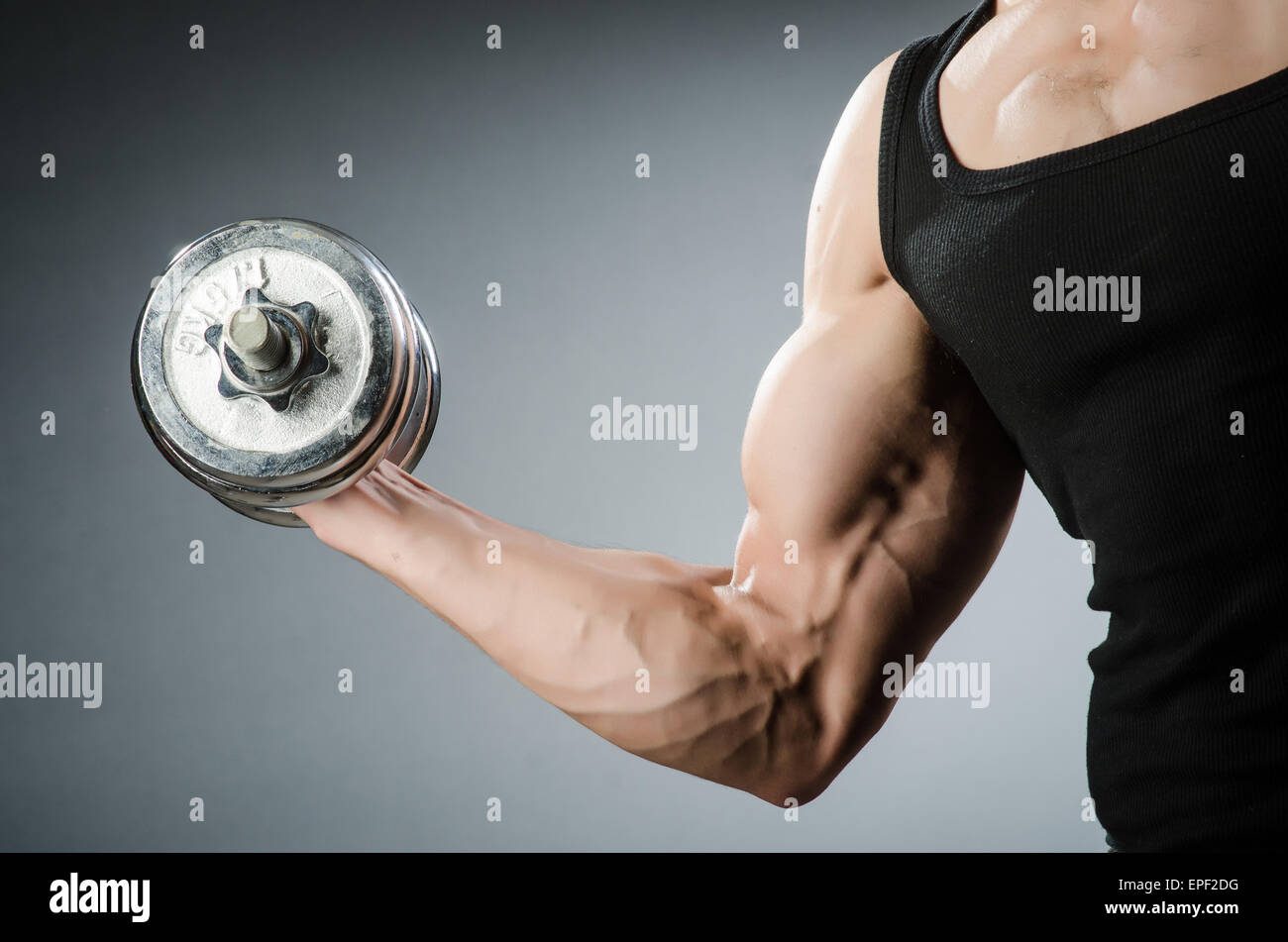 Muscular ripped bodybuilder with dumbbells Stock Photo - Alamy