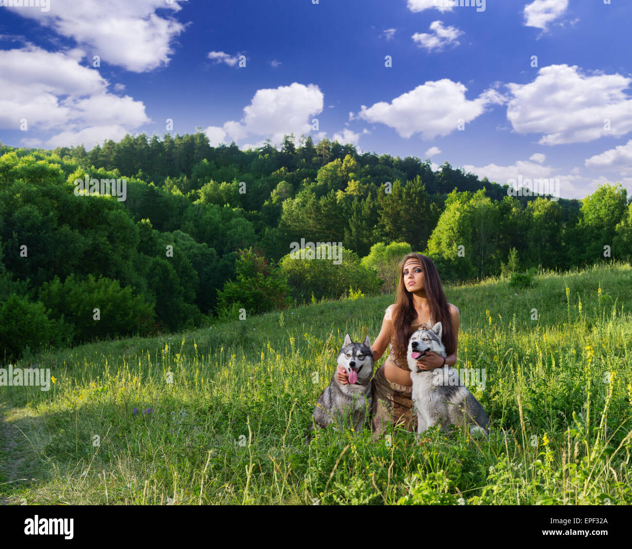 Young girl with two dogs at meadow Stock Photo - Alamy