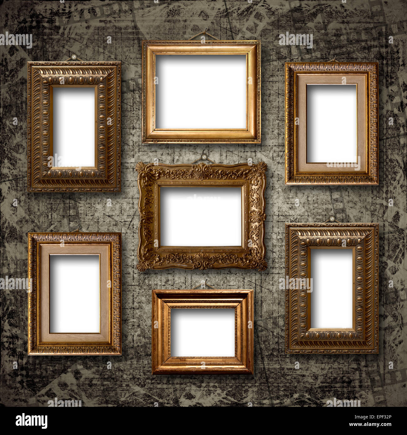 Gilded wooden frames for pictures on old stone wall Stock Photo