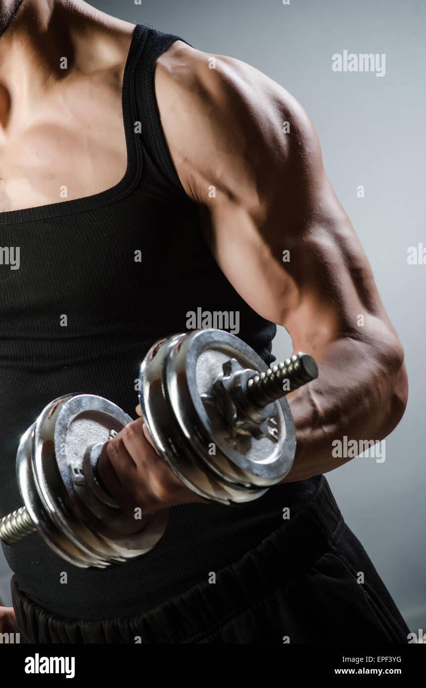 Muscular ripped bodybuilder with dumbbells Stock Photo - Alamy