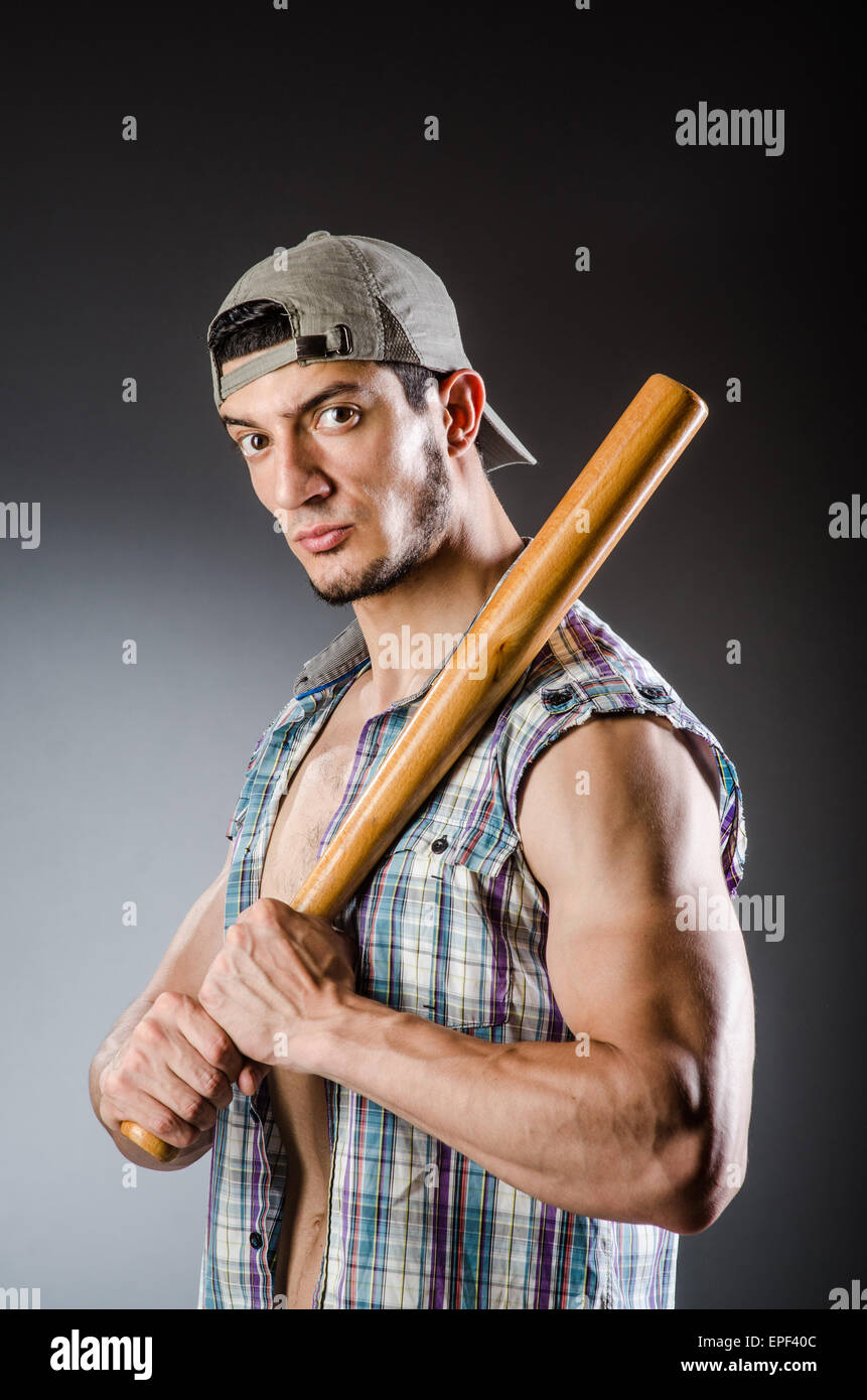 Violent man with baseball bat and hat Stock Photo Alamy