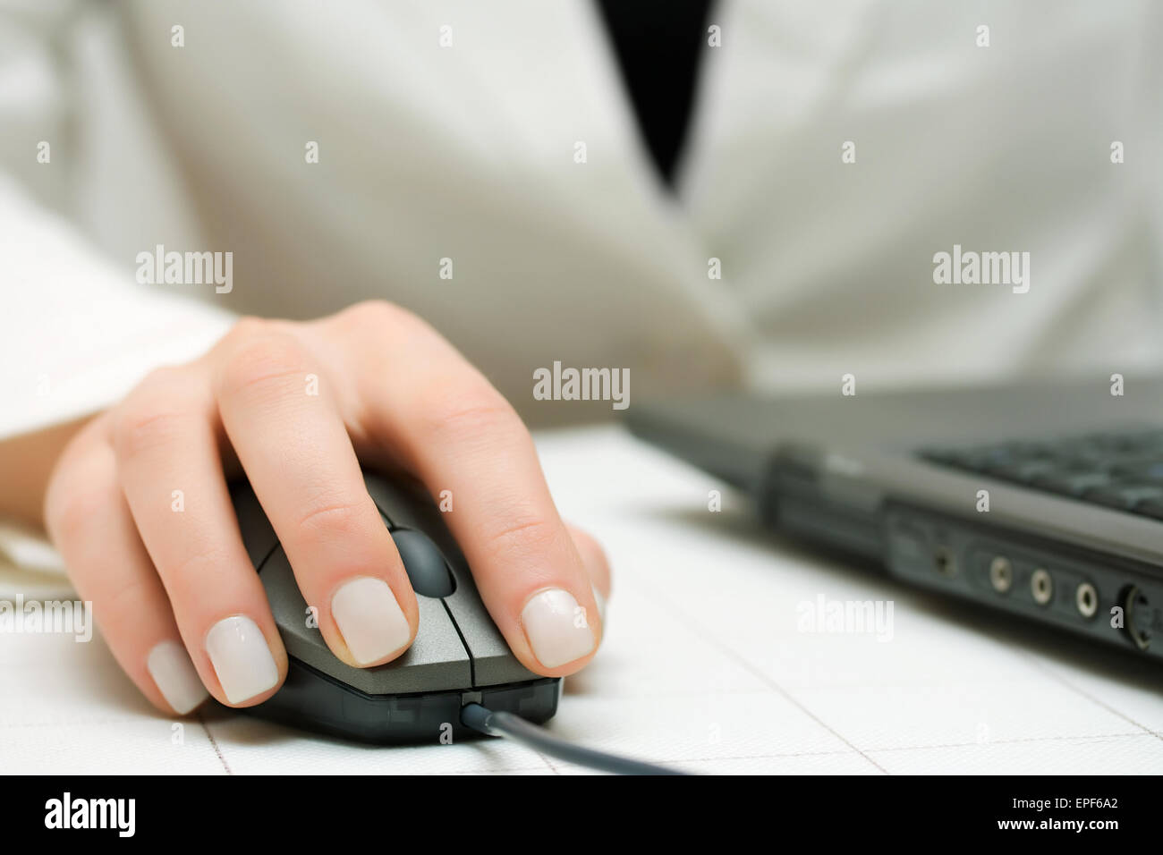 Female hand using computer mouse and keyboard Stock Photo - Alamy