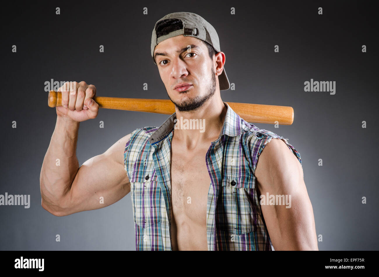 Violent man with baseball bat and hat Stock Photo Alamy