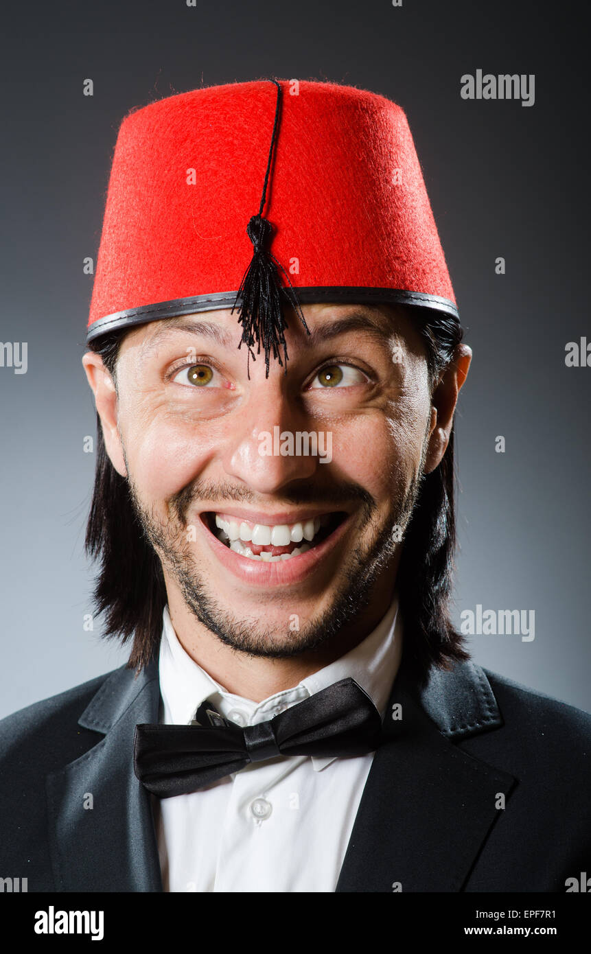 Man in traditional turkish hat and dress Stock Photo