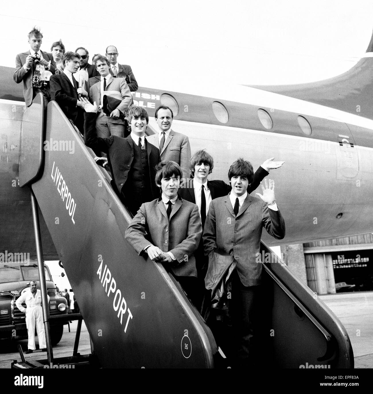Northern premier of The Beatles film 'A Hard Day's Night'. John Lennon, Paul McCartney, Ringo Starr and George Harrison pictured on the steps of the plane in Liverpool on 10th July 1964. Stock Photo