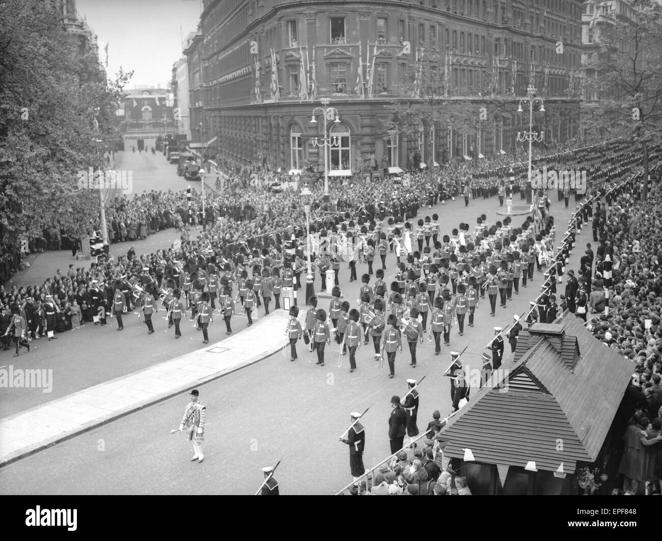 The Band and Corps of Drums of the Welsh and Irish Guards march down Northumberland Avenue ahead of the gold state coach carrying the Queen to Westminster Abbey for her coronation 2nd June 1952 Stock Photo