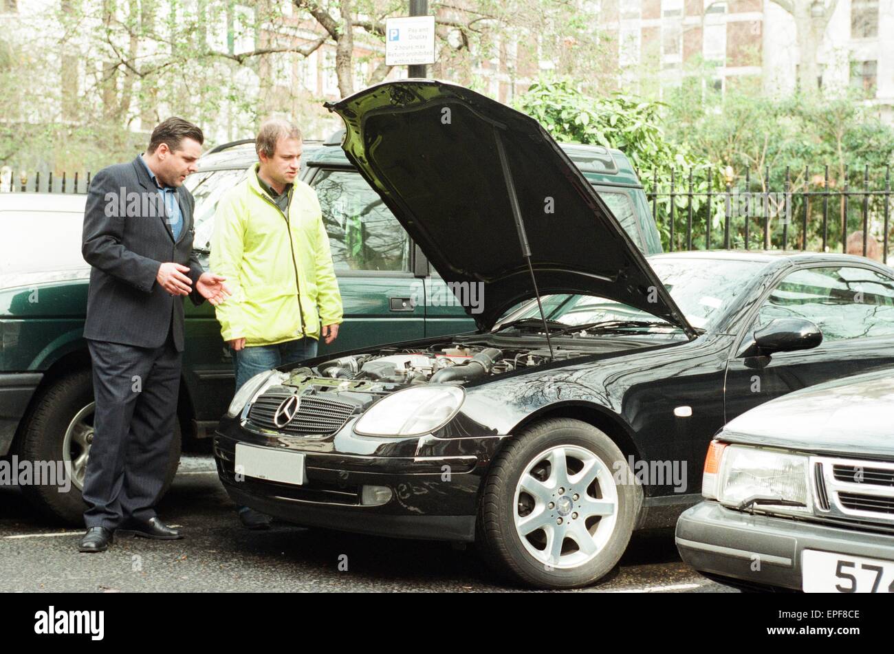 Harry Enfield sells his motorcar - SLK230 Mercedes - to Sunday Mirror Journalist Sean Hoare, 26th March 1999. Stock Photo