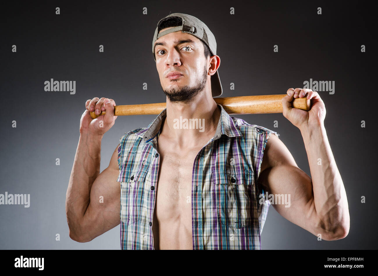 Violent man with baseball bat and hat Stock Photo Alamy