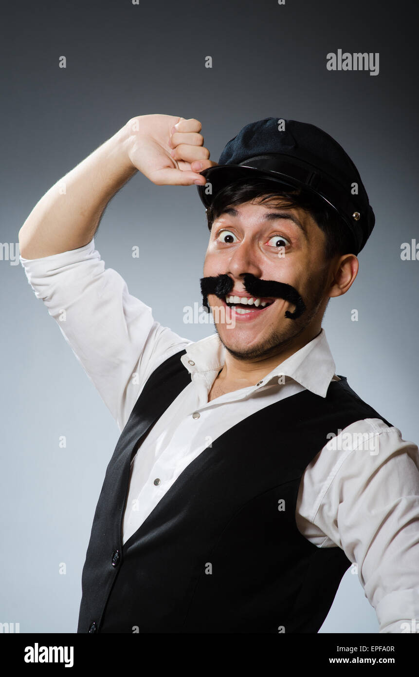 Funny taxi driver wearing peaked cap Stock Photo - Alamy