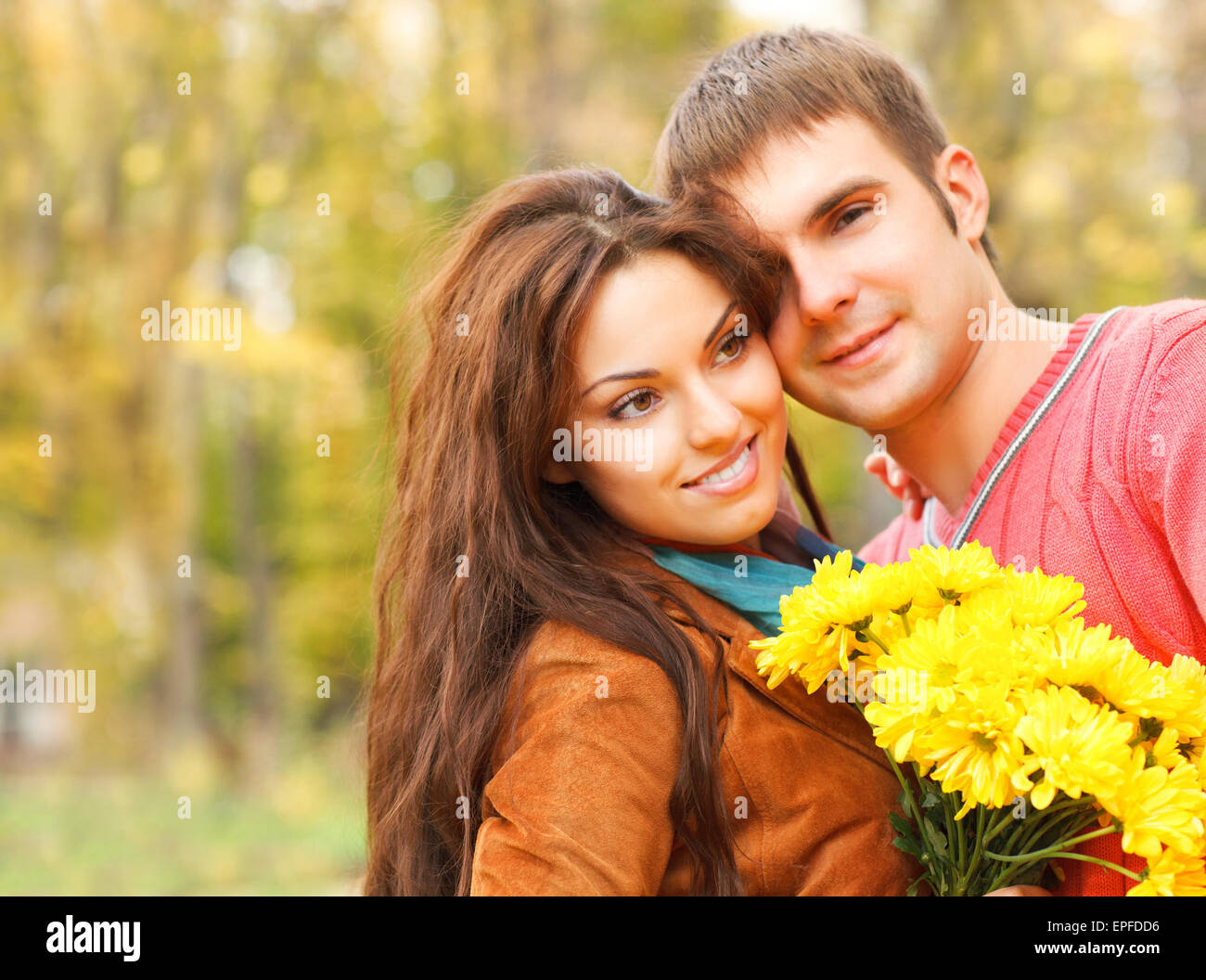 Portrait of couple enjoying golden autumn fall season Stock Photo