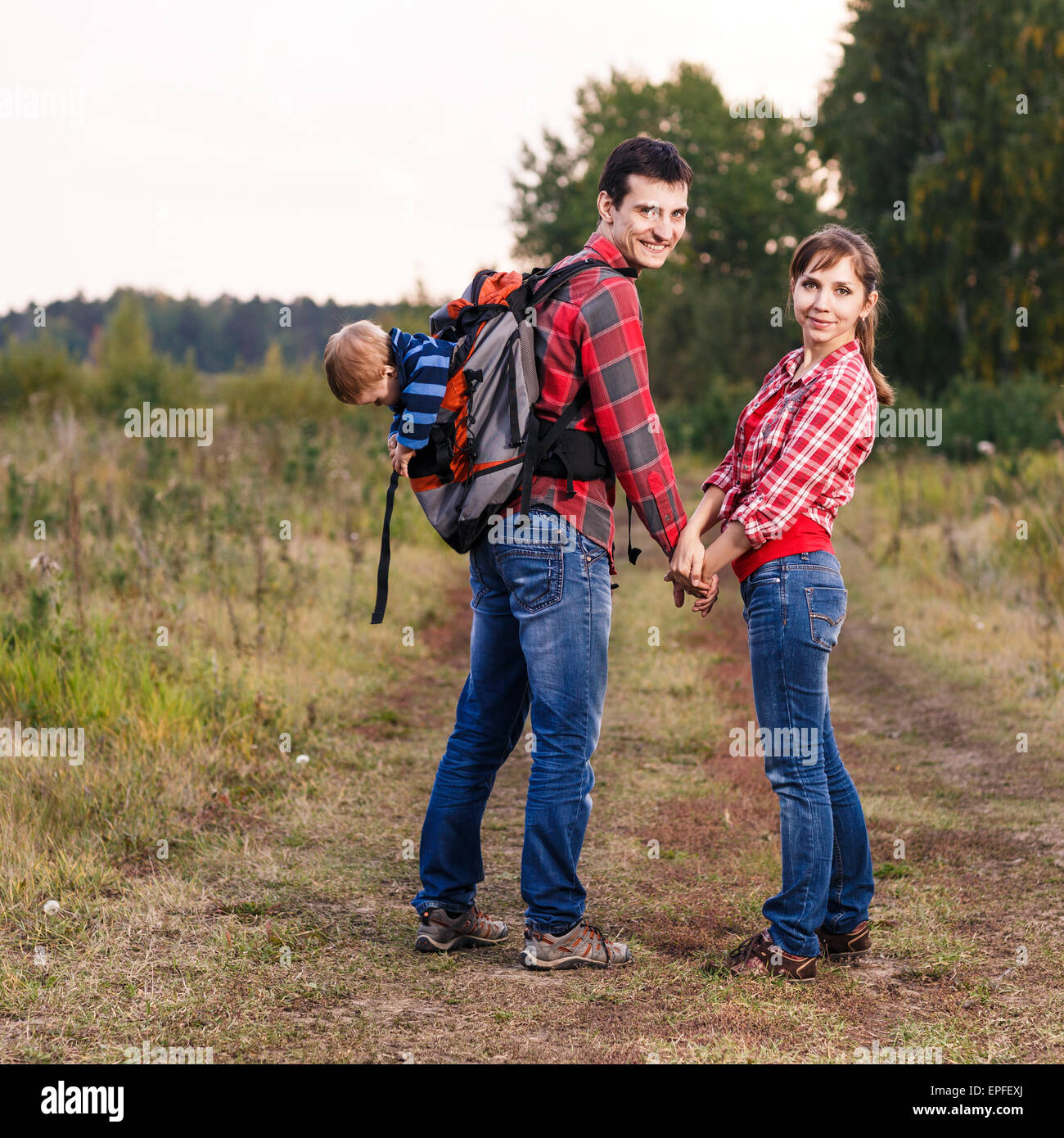 Baby boy in backpack Stock Photo Alamy