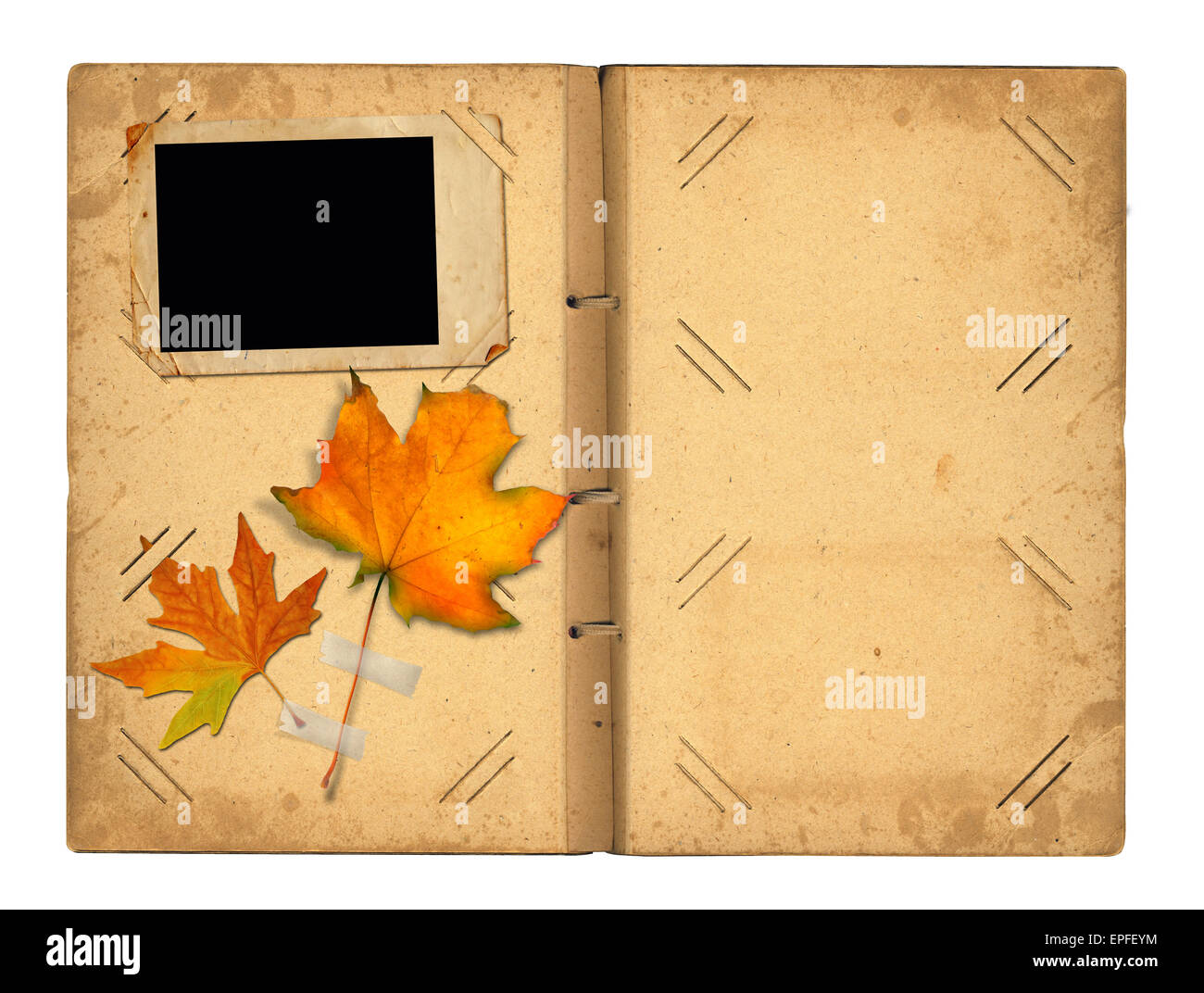 Open vintage photoalbum for photos with autumn foliage on white isolated background Stock Photo