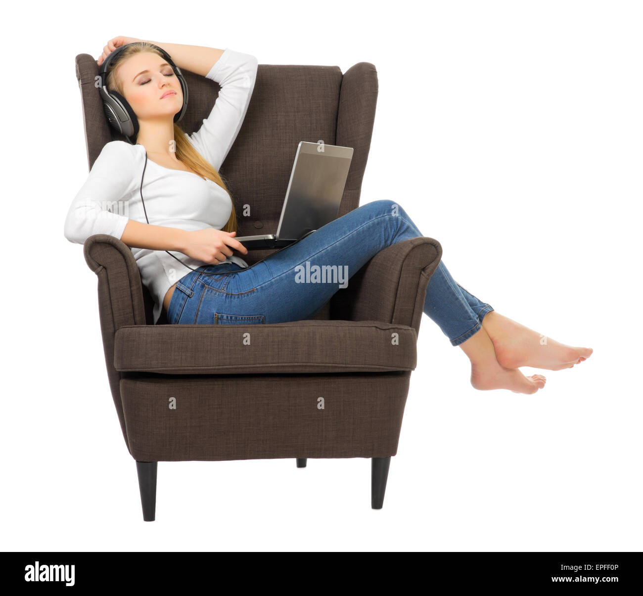 Young girl listen music on chair isolated Stock Photo Alamy