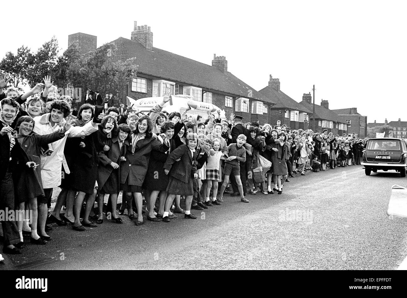 The Beatles in Liverpool for the Premier of a Hard Day's Night. Fans line the streets in hope to catch a glimpse of The Beatles during their trip to Liverpool 10th July 1964. Stock Photo