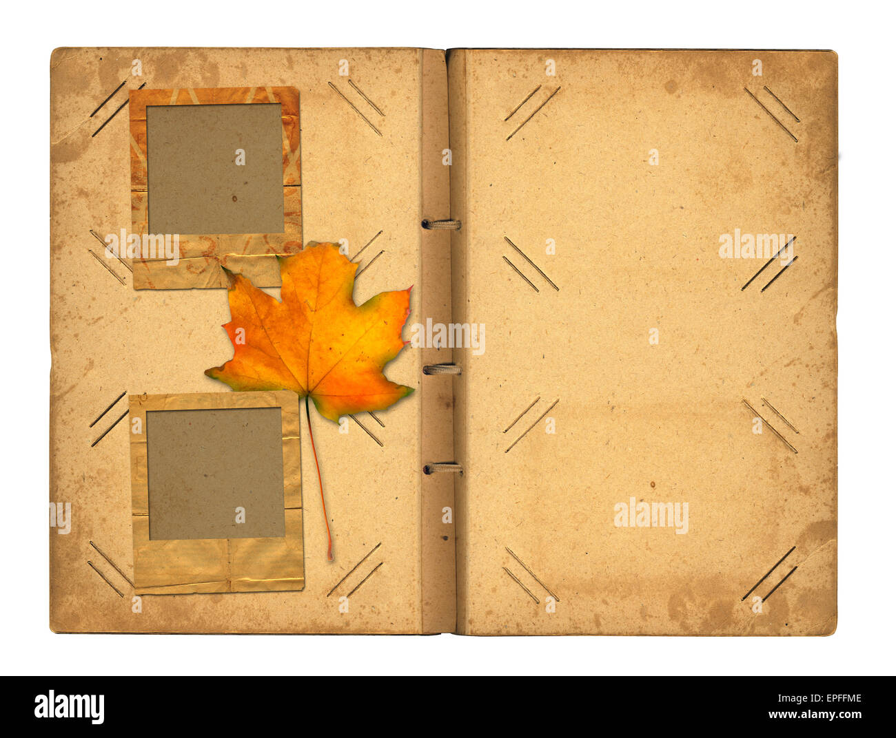 Open vintage photoalbum for photos with autumn foliage on white isolated background Stock Photo
