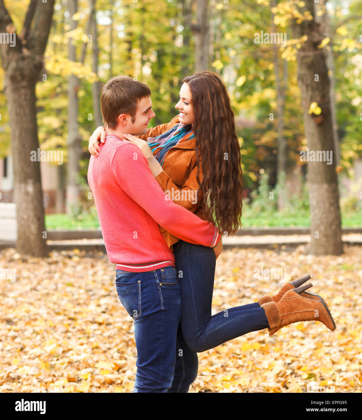 Portrait of happy couple enjoying golden autumn Stock Photo