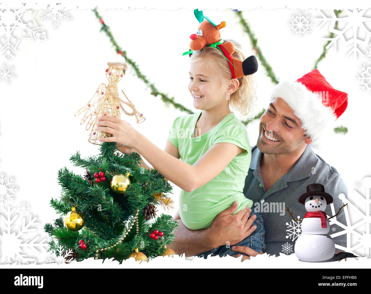 Cute little girl decorating the christmas tree with her father Stock ...