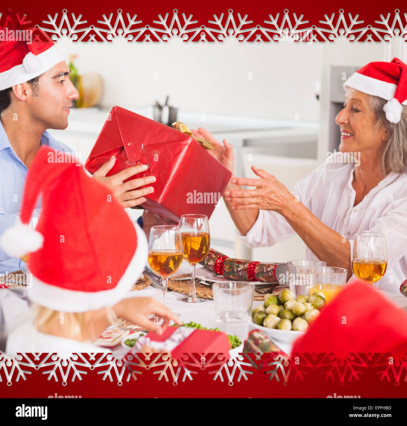 Change Gift Composite image of family exchanging christmas presents Stock Photo - Alamy