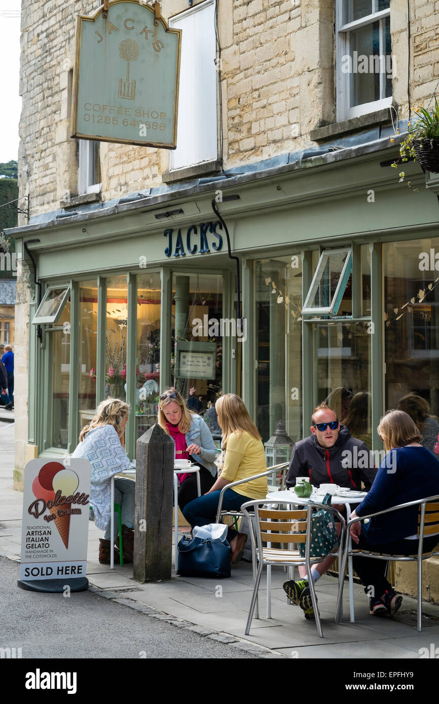 People seated at tables outside Jack's cafe , Blackjack Street, Cirencester, Gloucestershire