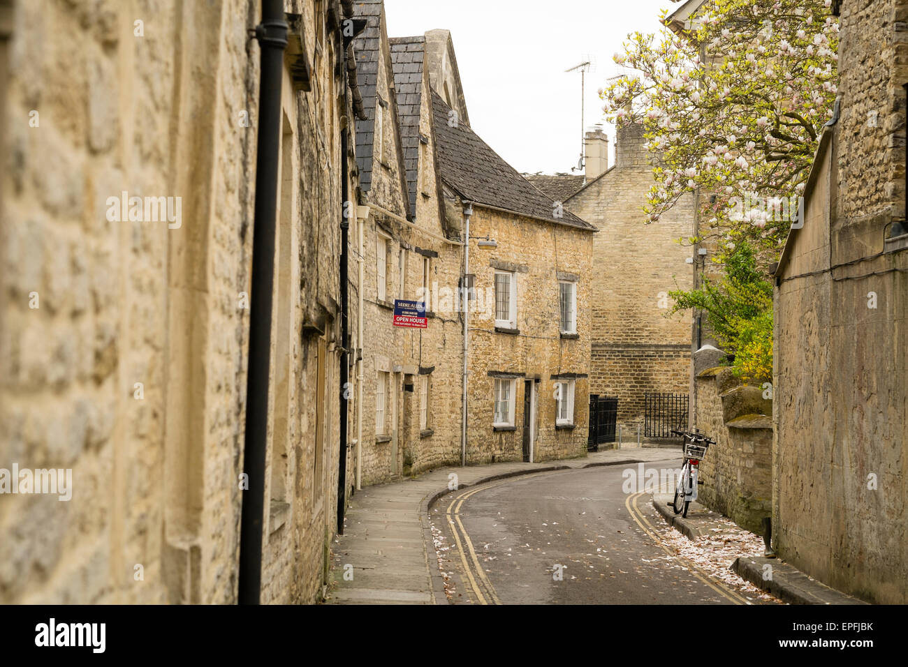 Rows of typical Cotswold mellow yellow sandstone houses in the narrow quaint Coxwell Street , one of the most sought-after addresses in Cirencester, Gloucestershire, England UK Stock Photo