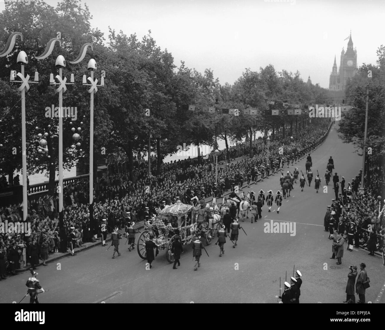 The Queen and the Duke of Edinburgh in the gold state coach pass down Victoria Embankment, as she makes her way to Westminster Abbey for the coronation 2nd June 1952 Stock Photo