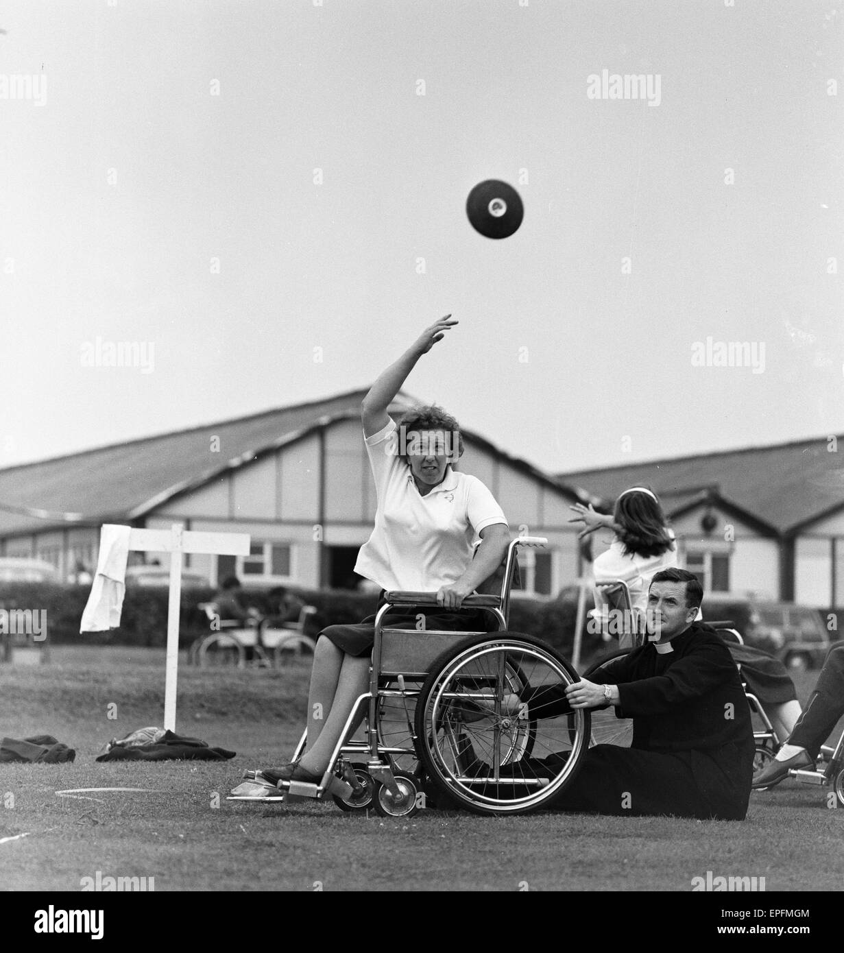 Paralympic Athletes training at Stoke Mandeville, watched by patients, ahead of the 1964 Paralympics to be held in Tokyo, pictured 22nd July 1964. Stock Photo