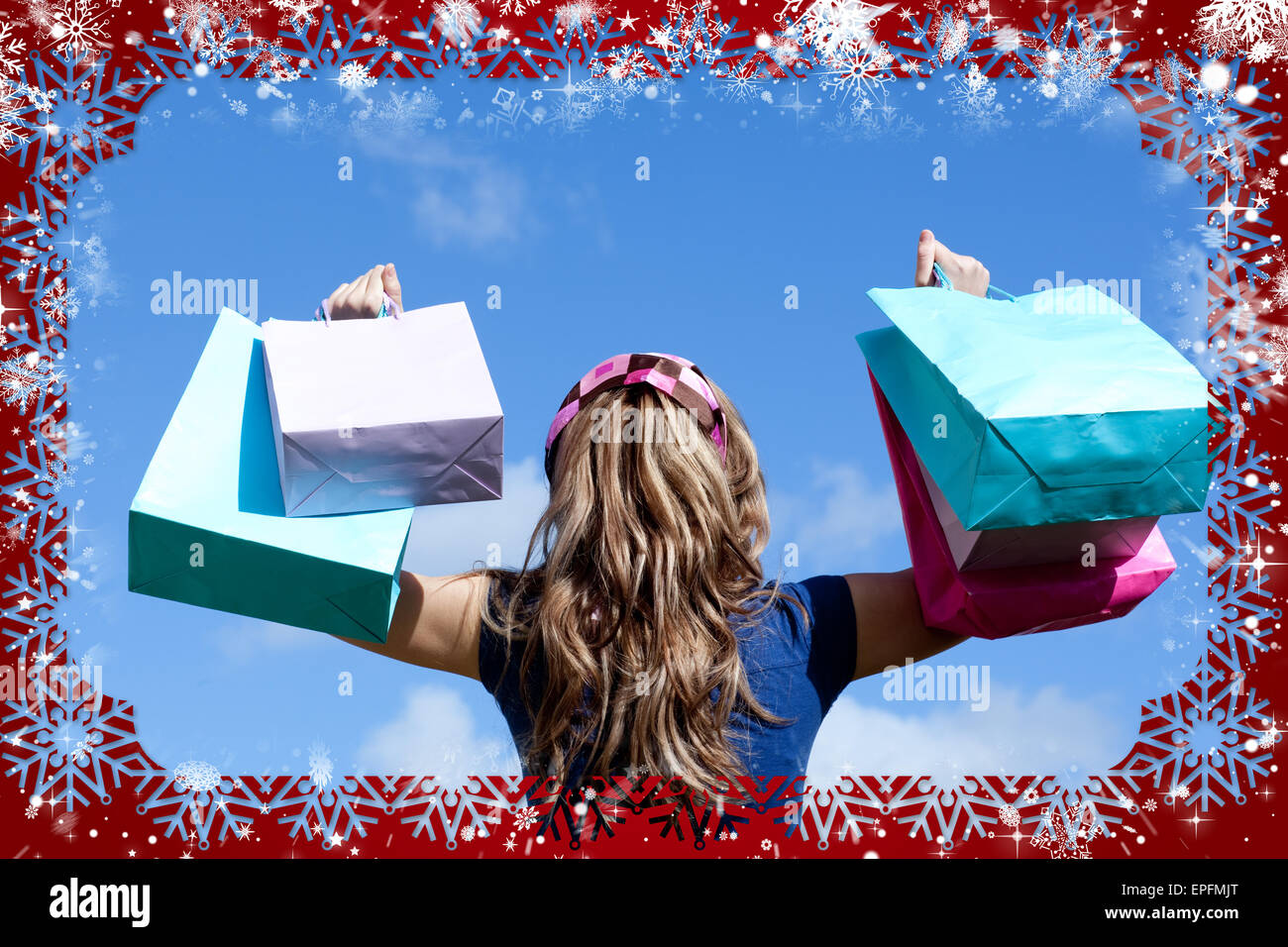 Young woman holding shopping bags outdoor Stock Photo