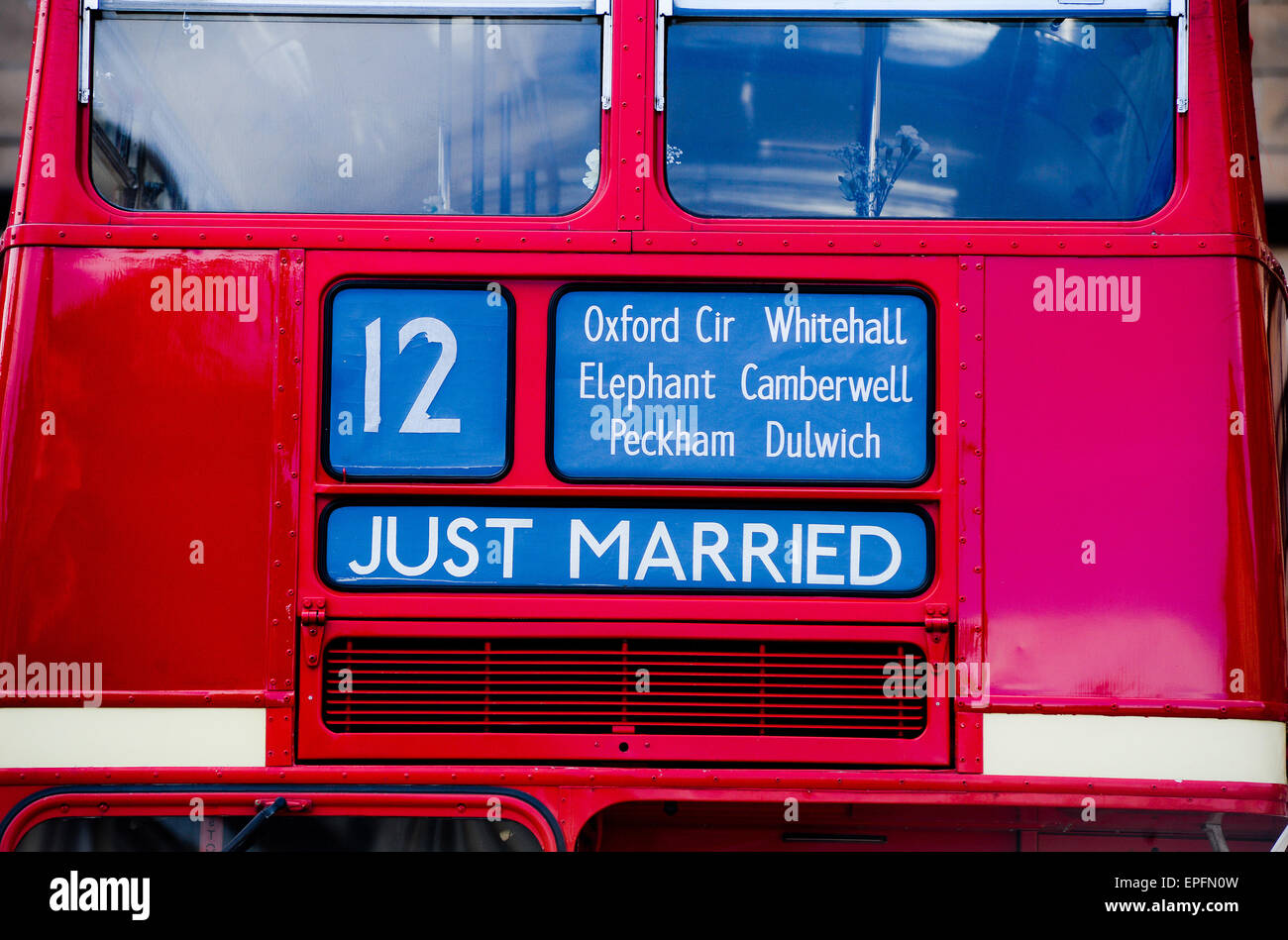 Just Married on a Red Bus Stock Photo