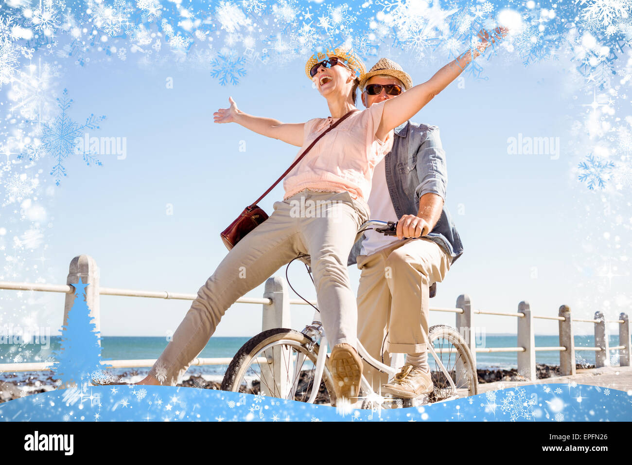 Happy Bike Ride Happy casual couple going for a bike ride on the pier Stock Photo - Alamy